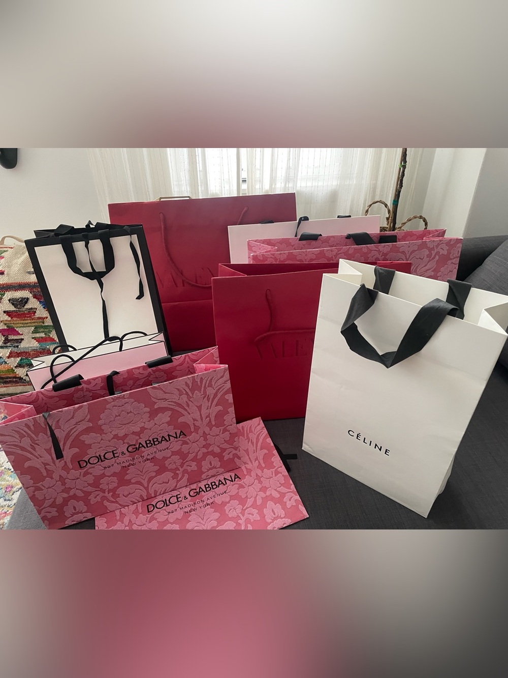 Assortment designer shopping Bags Gucci Chanel Celine Valentino Dolce & Gabbana